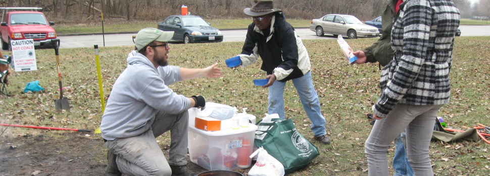 Chris Weber, field organizer, hands out free snacks during a restoration workday at Whistler Woods.